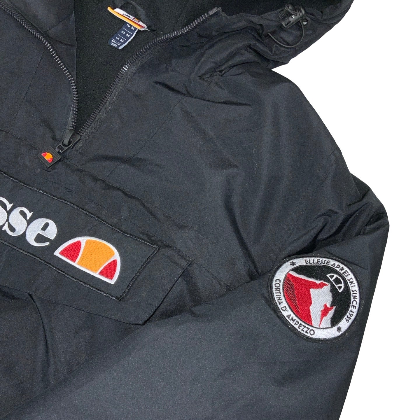 Vintage 90s ‘Ellesse’ Black Pull-Over Spell-Out Windbreaker Coat M L XL